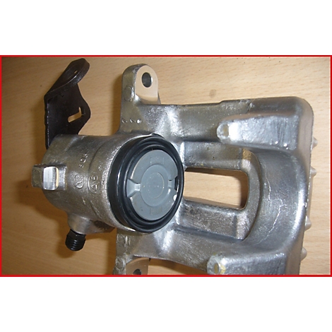 Grauer Bremssattel, Details: schwarze Dichtung, grauer Deckel. An der Seite ein schwarzes Anbauteil.